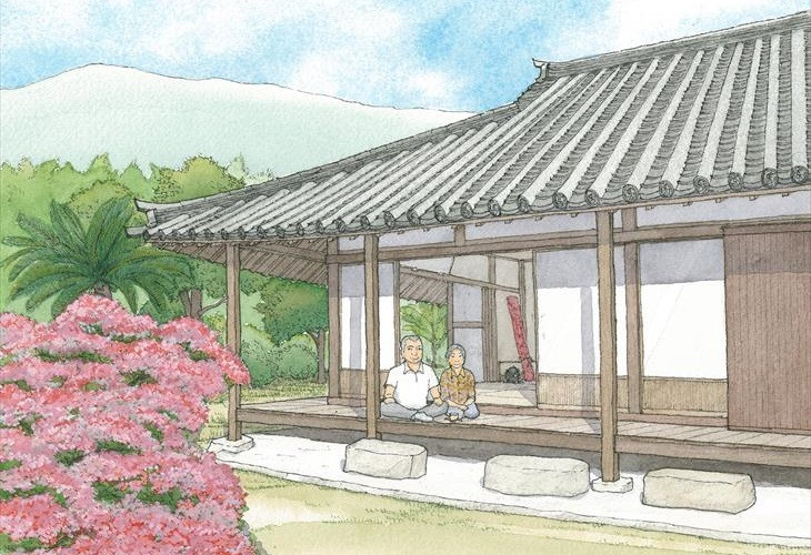 机を挟んで話している二人の女性